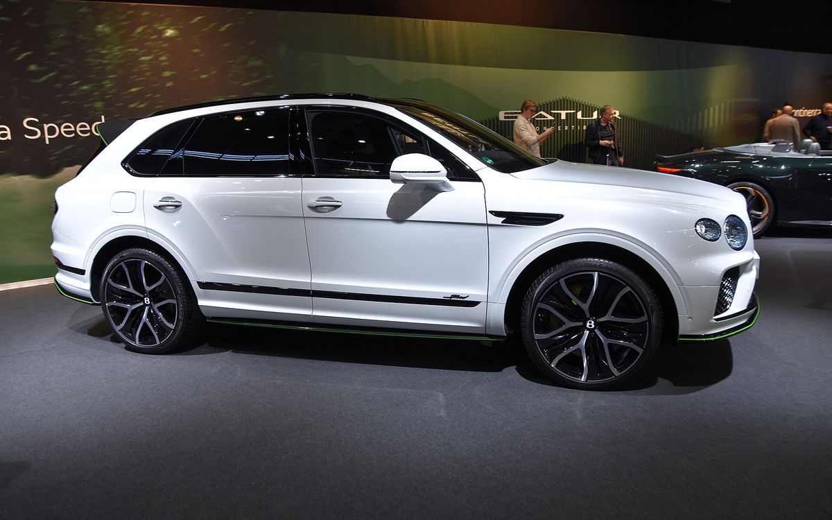 White Bentley Bentayga Speed on a show stand, side view